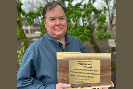 Jay Solomon with award from Northwest Illinois Forestry Association