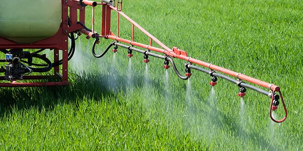 tractor spraying insecticide